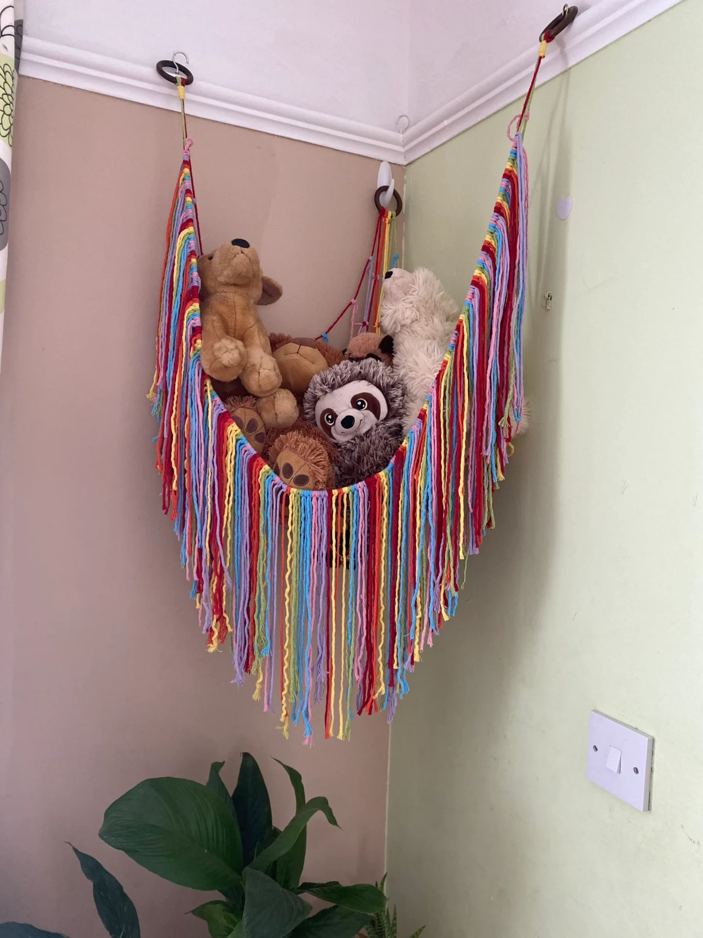 Soft toy storage corner hammock, made with recycled cotton.