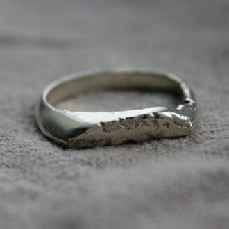 Textured sterling silver ring cast in sand