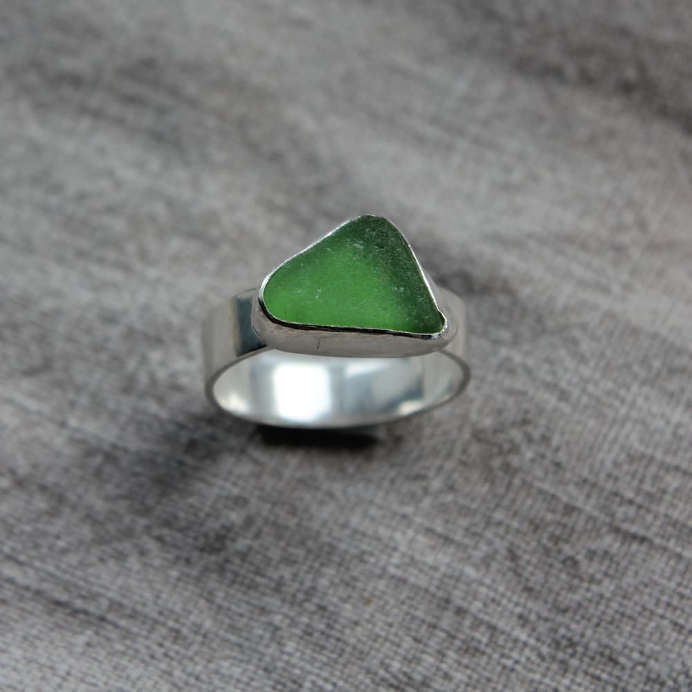 green triangle seaglass ring with a flat sterling silver band