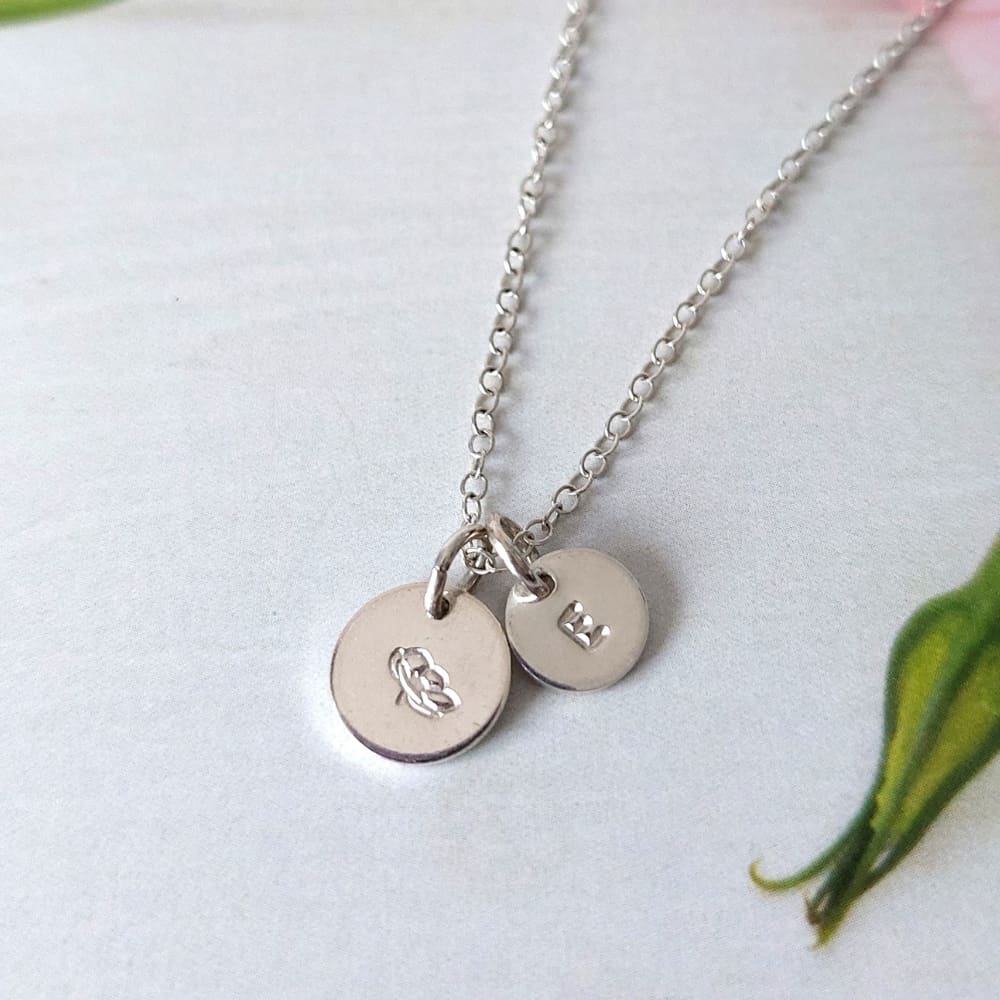 sterling silver disc necklace with birthflower hand-stamped on 9mm disc with optional tiny initial disc