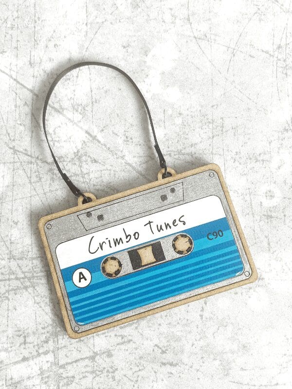 Cassette tape decoration with a silver tape and a blue label that says Crimbo Tunes