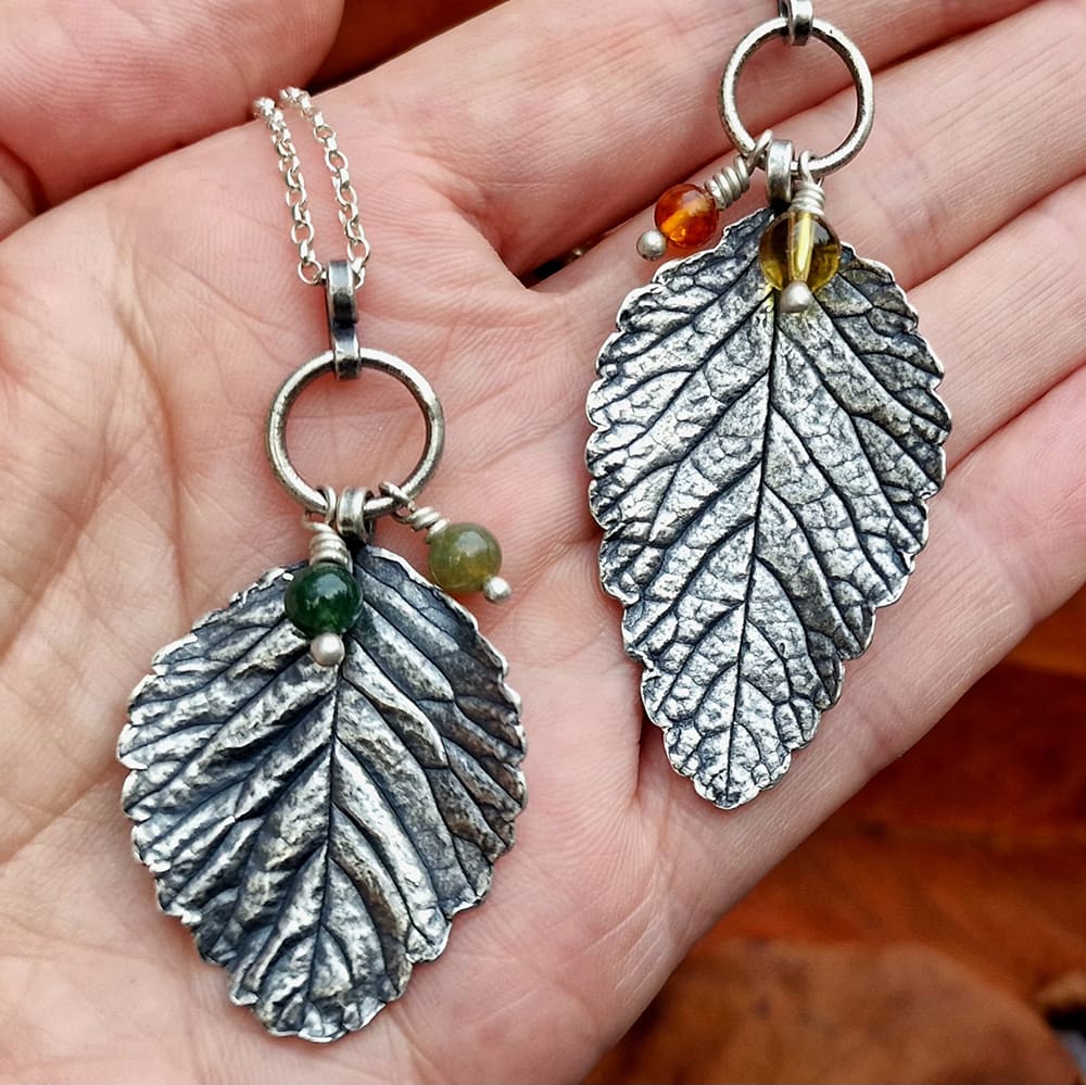 two silver leaf pendants necklaces