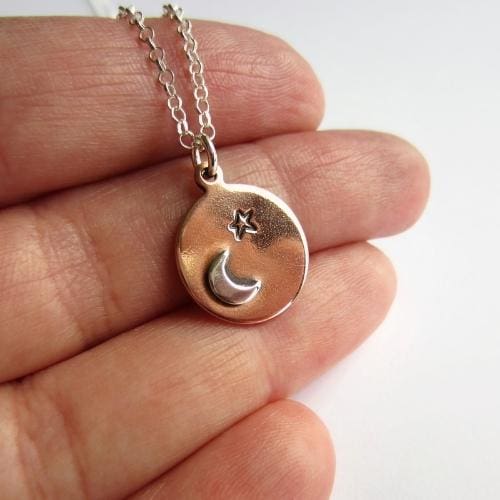 Small round handstamped star and crescent moon copper and sterling silver necklace, artisan made by The Tiny Tree Frog Jewellery