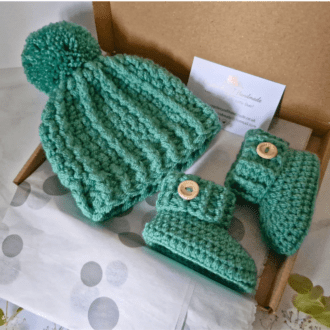 Sage green newborn baby crochet set including a pom pom hat and booties