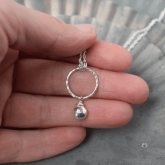 Sterling silver textured circle necklace with silver nugget charm