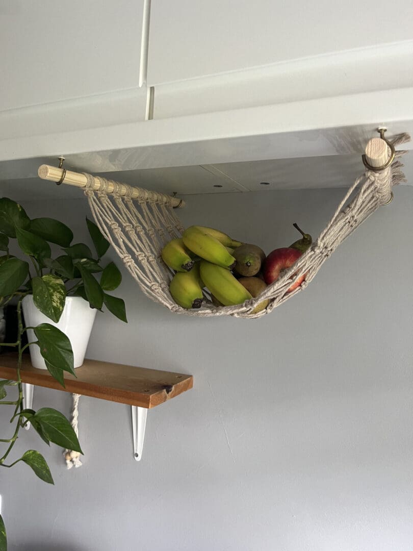 Under cabinet space saving fruit hammock made with taupe recycled cotton