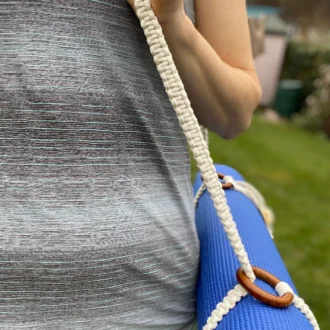 Macrame yoga mat strap, handmade using recycled yarn and repurposed wooden rings.