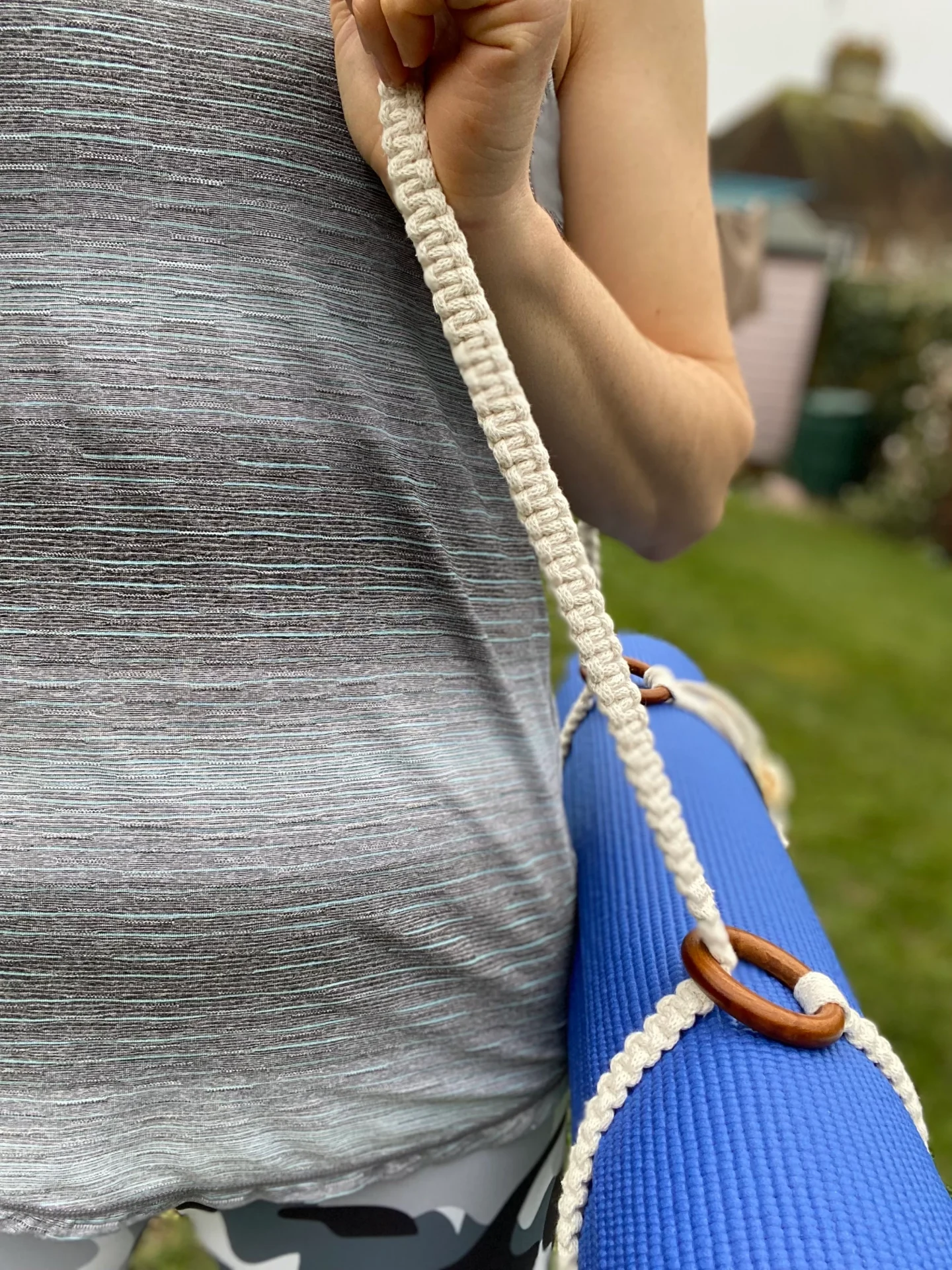 Macrame yoga mat strap, handmade using recycled yarn and repurposed wooden rings.