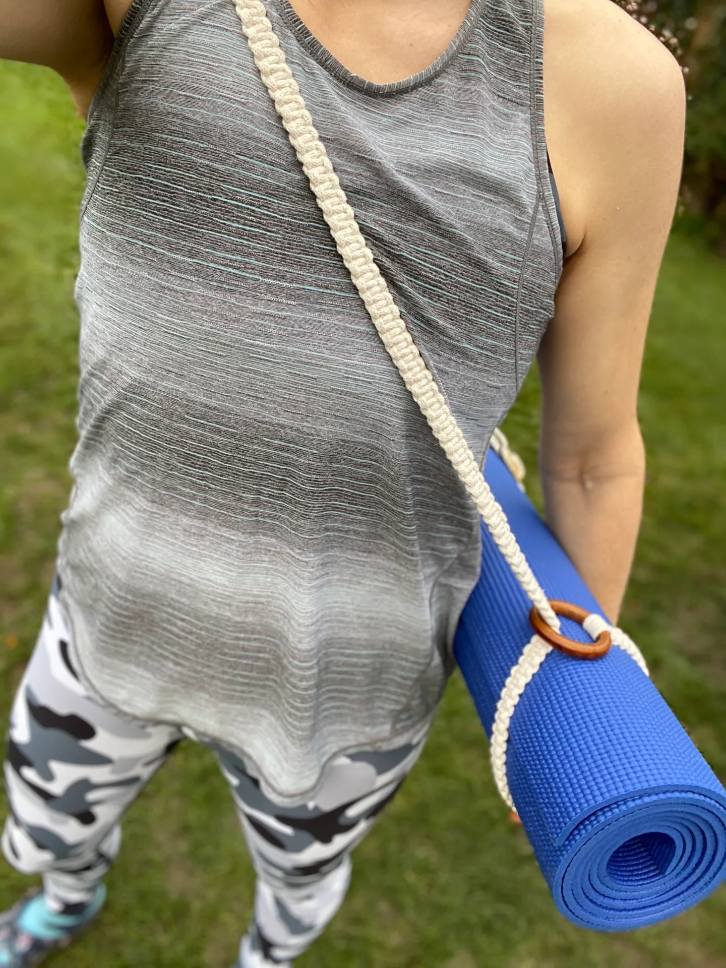 Macrame yoga mat strap, handmade using recycled yarn and repurposed wooden rings.