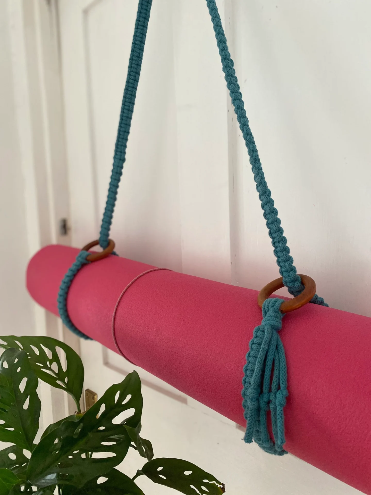 Macrame yoga mat strap, handmade using recycled yarn and repurposed wooden rings.