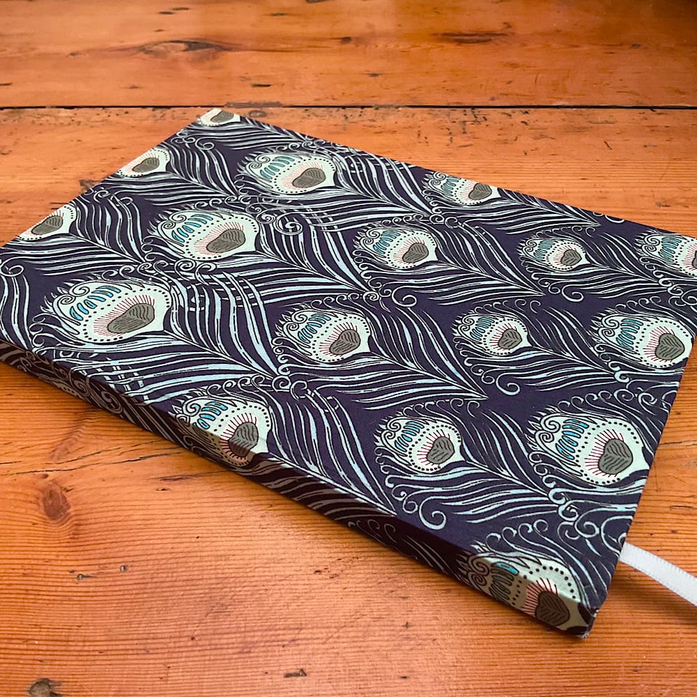 A5 handmade notebook covered in Liberty Caesar fabric with plain paper