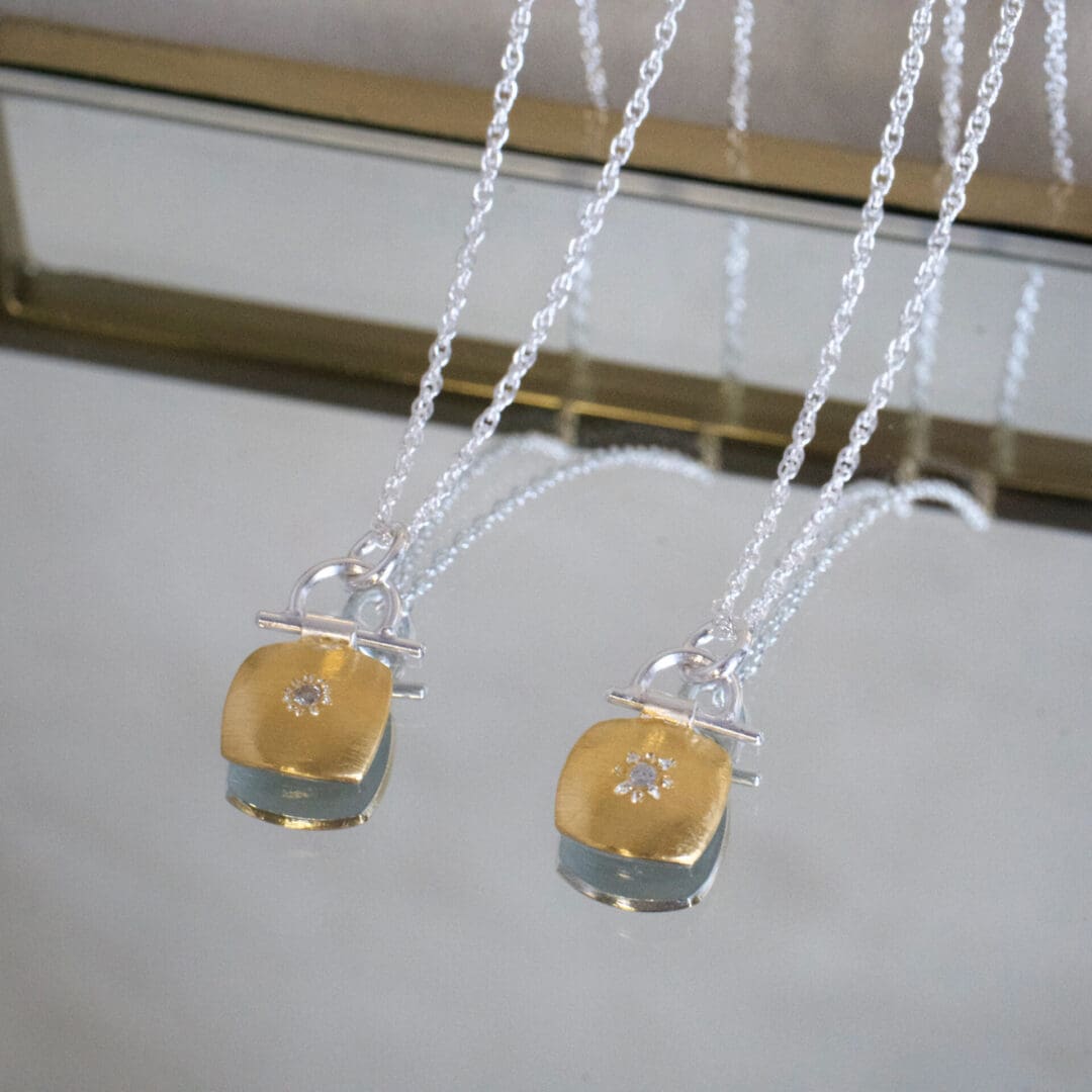 Two keum boo and diamond set silver pendant necklaces.