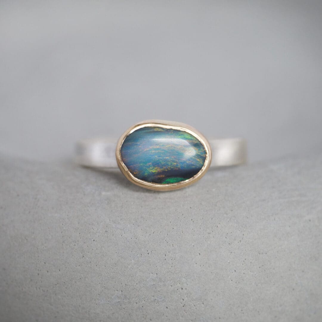 Australian boulder opal ring with 9ct yellow gold bezel and sterling silver