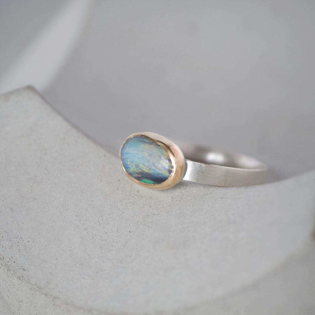 Australian boulder opal ring with 9ct yellow gold bezel and sterling silver