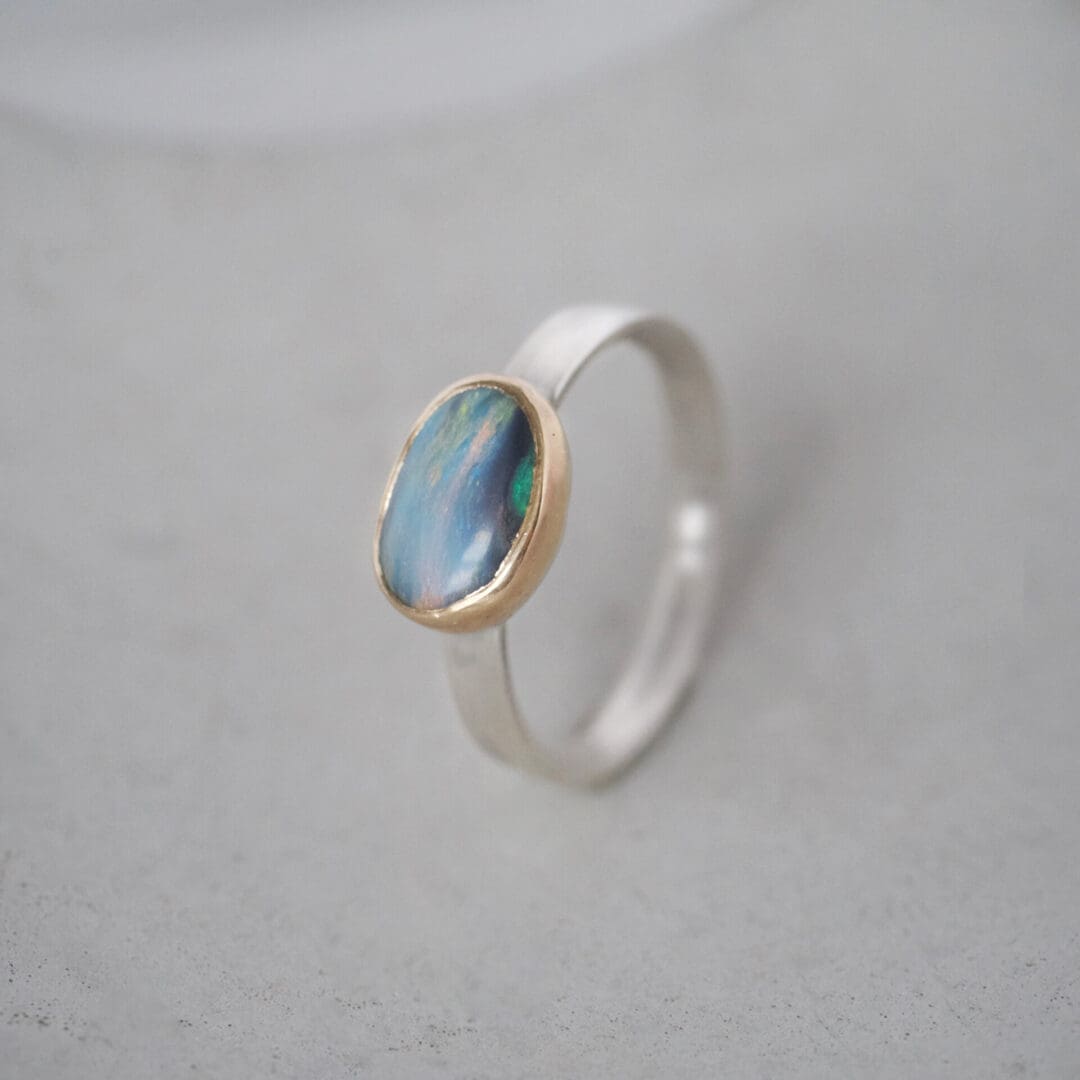 Australian boulder opal ring with 9ct yellow gold bezel and sterling silver