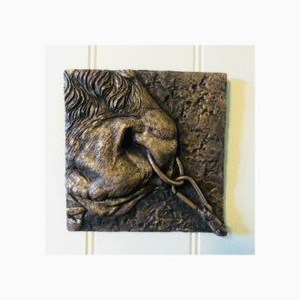 Cold-cast Bronze Taurus the Bull wall art sculpture in shallow bass relief by sculptor Kirsty Armstrong.