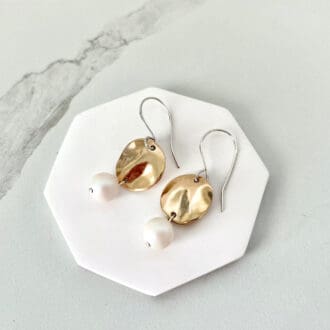 Round Bronze and pearl handmade drop earrings with sterling silver ear wires. Displayed in white gift box with a black velvet insert.