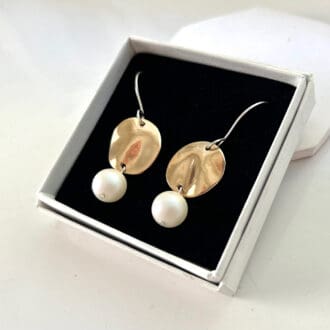 Round Bronze and pearl handmade drop earrings with sterling silver ear wires. Displayed in white gift box with a black velvet insert.