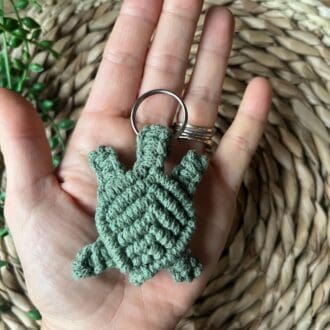 Handmade macrame turtle keyring, made with green recycled cotton yarn