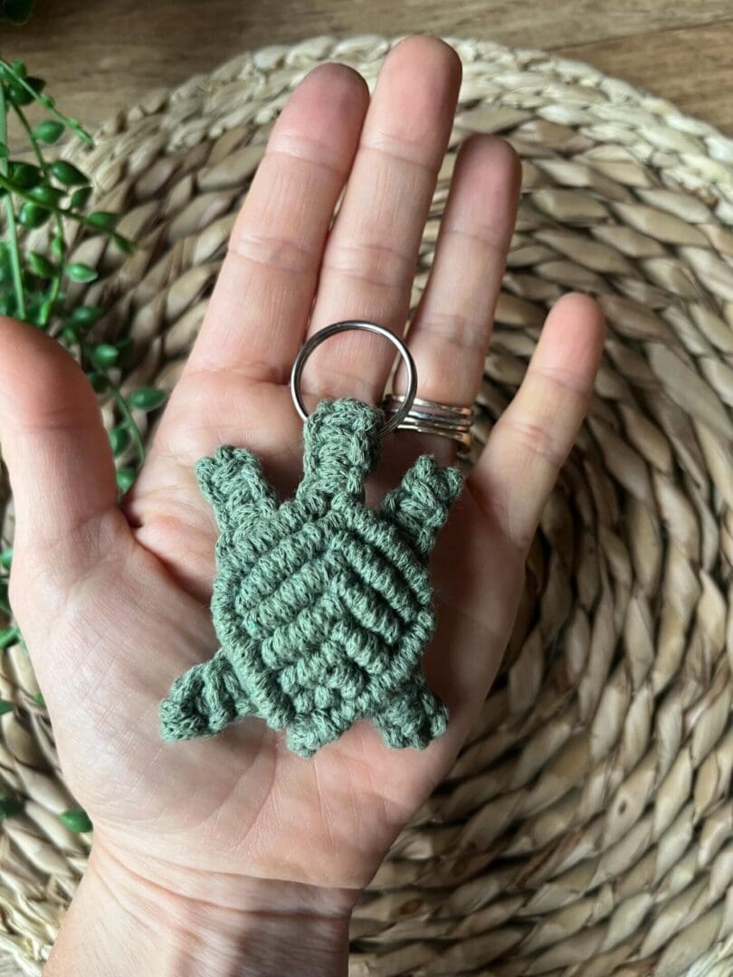 Handmade macrame turtle keyring, made with green recycled cotton yarn