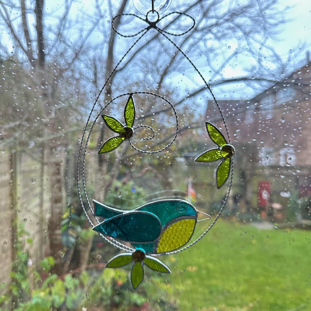 Stained glass blue tit and flower suncatcher