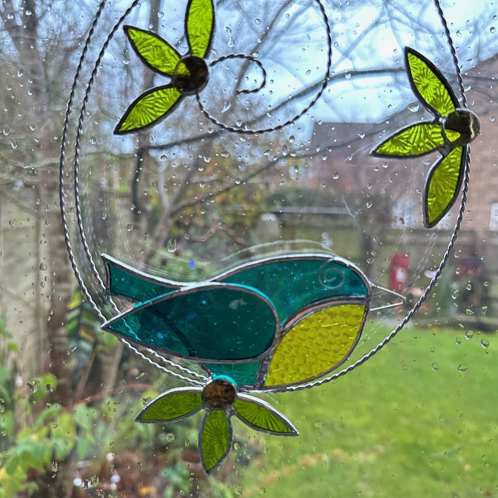 Stained glass blue tit and flower suncatcher