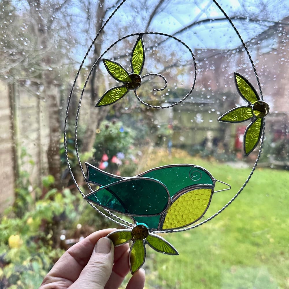 Stained glass blue tit and flower suncatcher