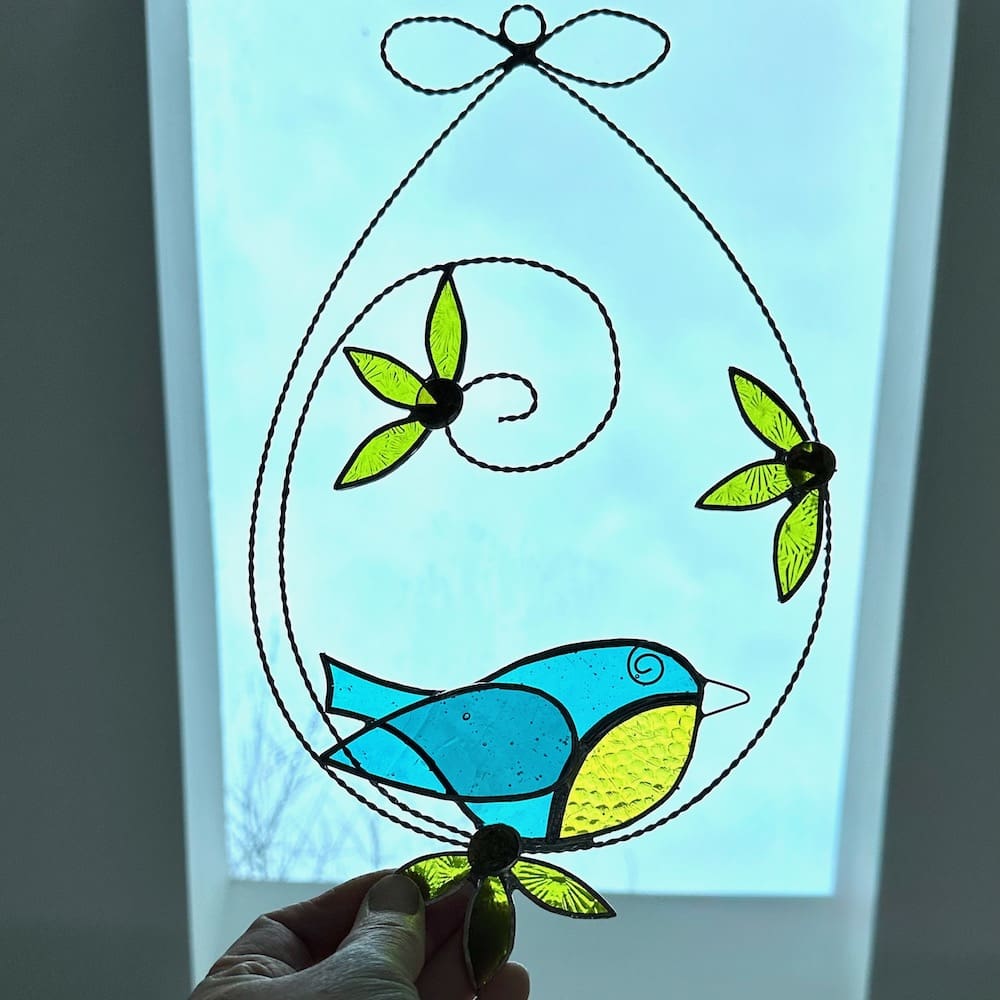 Stained glass blue tit and flower suncatcher