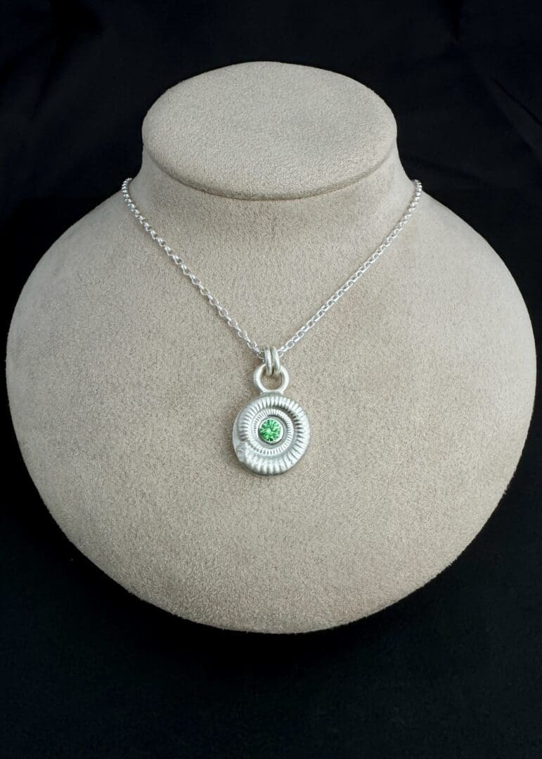 My Jewellery Garden Handmade Recycled Sterling Silver Ammonite Pendants with Green or Teal Cubic Zirconia