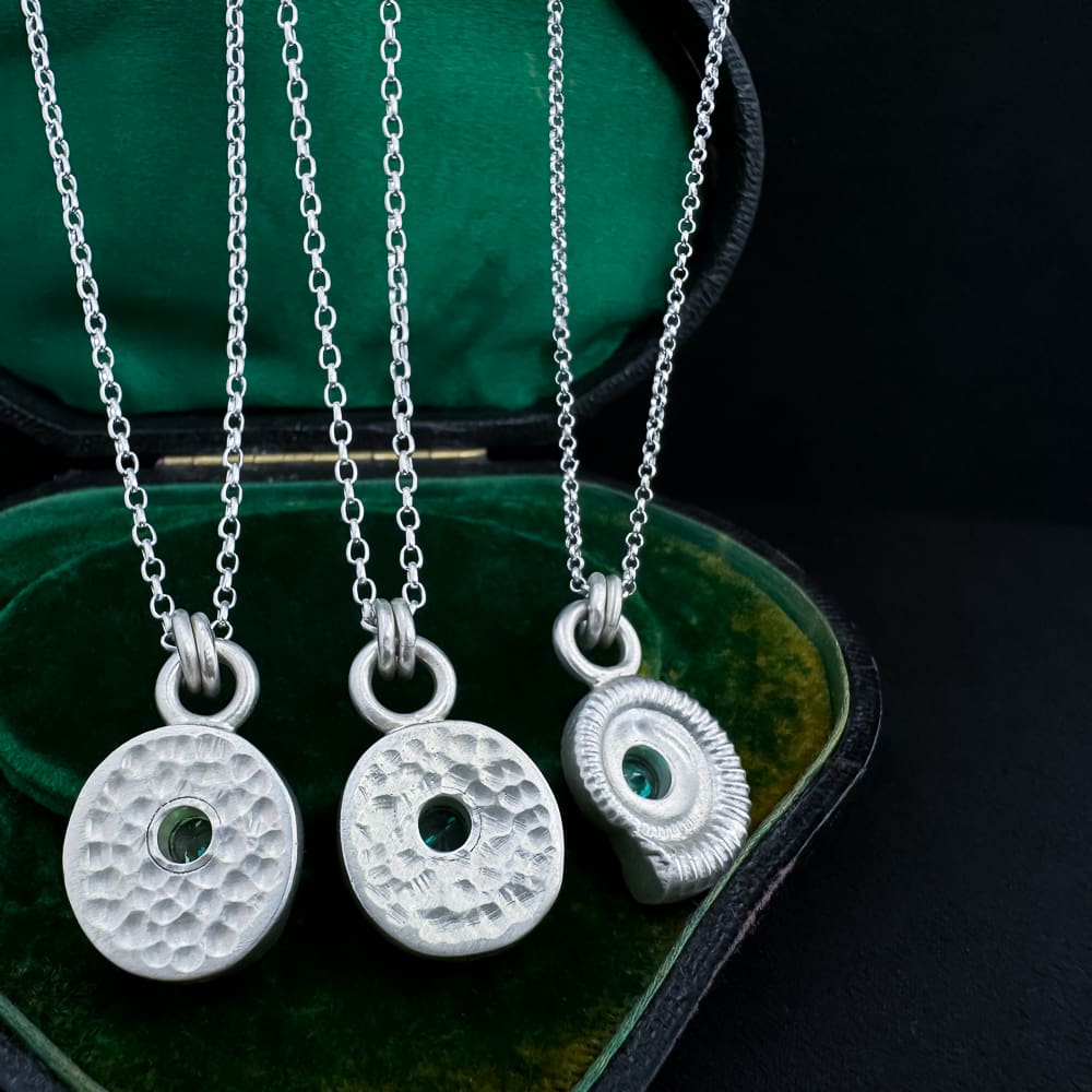 My Jewellery Garden Handmade Recycled Sterling Silver Ammonite Pendants with Green or Teal Cubic Zirconia