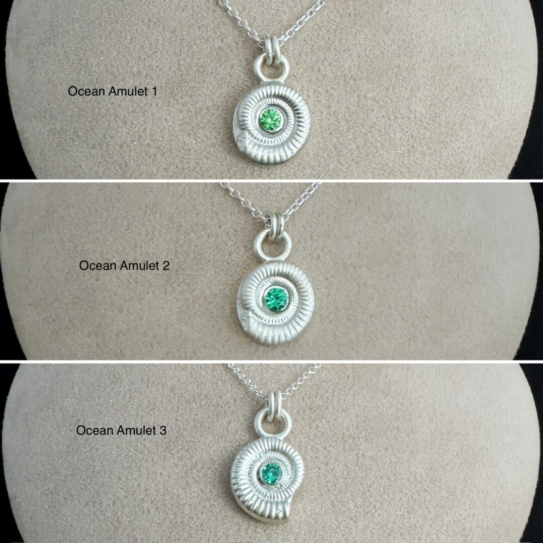 My Jewellery Garden Handmade Recycled Sterling Silver Ammonite Pendants with Green or Teal Cubic Zirconia