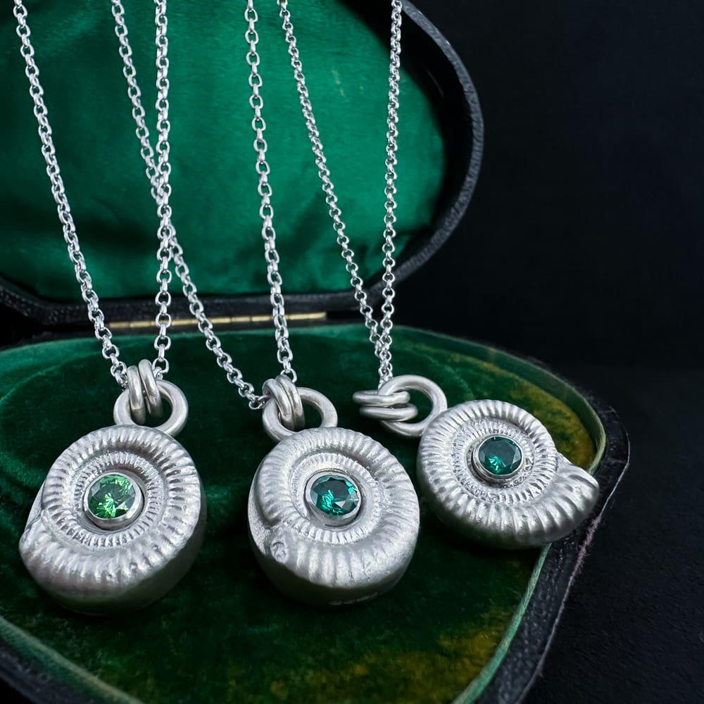 My Jewellery Garden Handmade Recycled Sterling Silver Ammonite Pendants with Green or Teal Cubic Zirconia