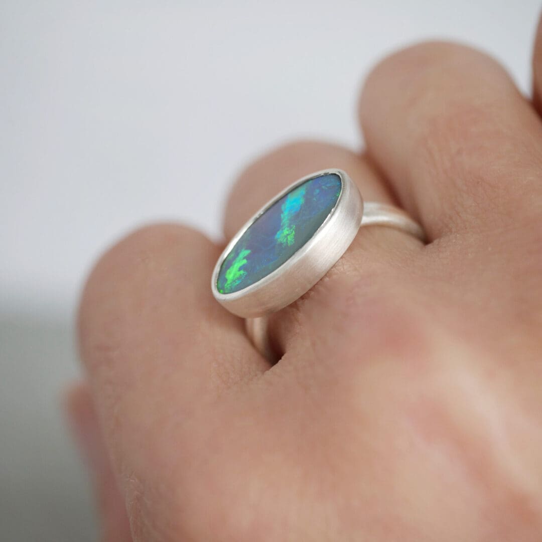 Lightning Ridge Oval Opal dual ring in Argentium Silver, worn