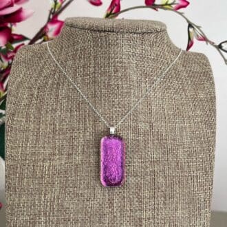 Bright pink sparkly dichroic glass pendant on a sterling silver chain