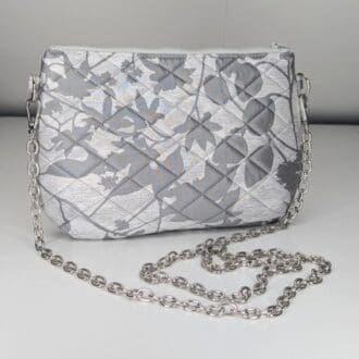 Chic silver handbag with a quilted texture and versatile chain strap