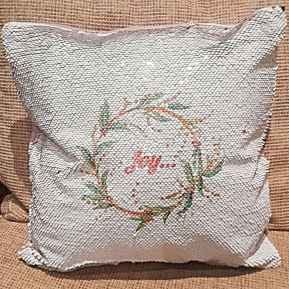 Festive Sequin Cushion With Joy and Christmas Wreath Artwork and reversible sequins to plain