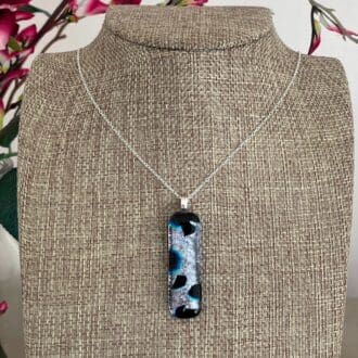 Super sparkly silver and black dichroic glass pendant on a sterling silver chain