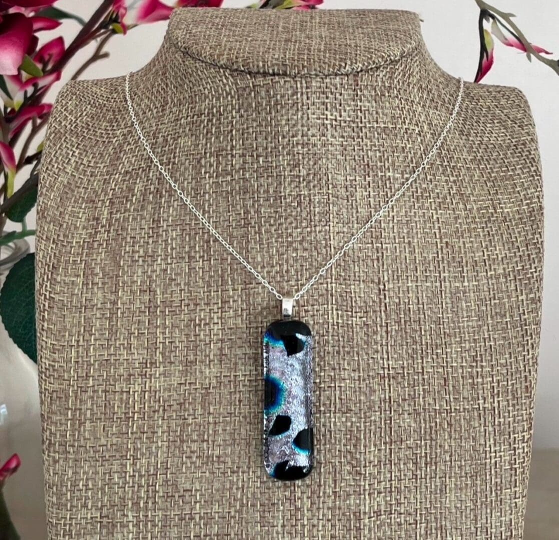 Super sparkly silver and black dichroic glass pendant on a sterling silver chain