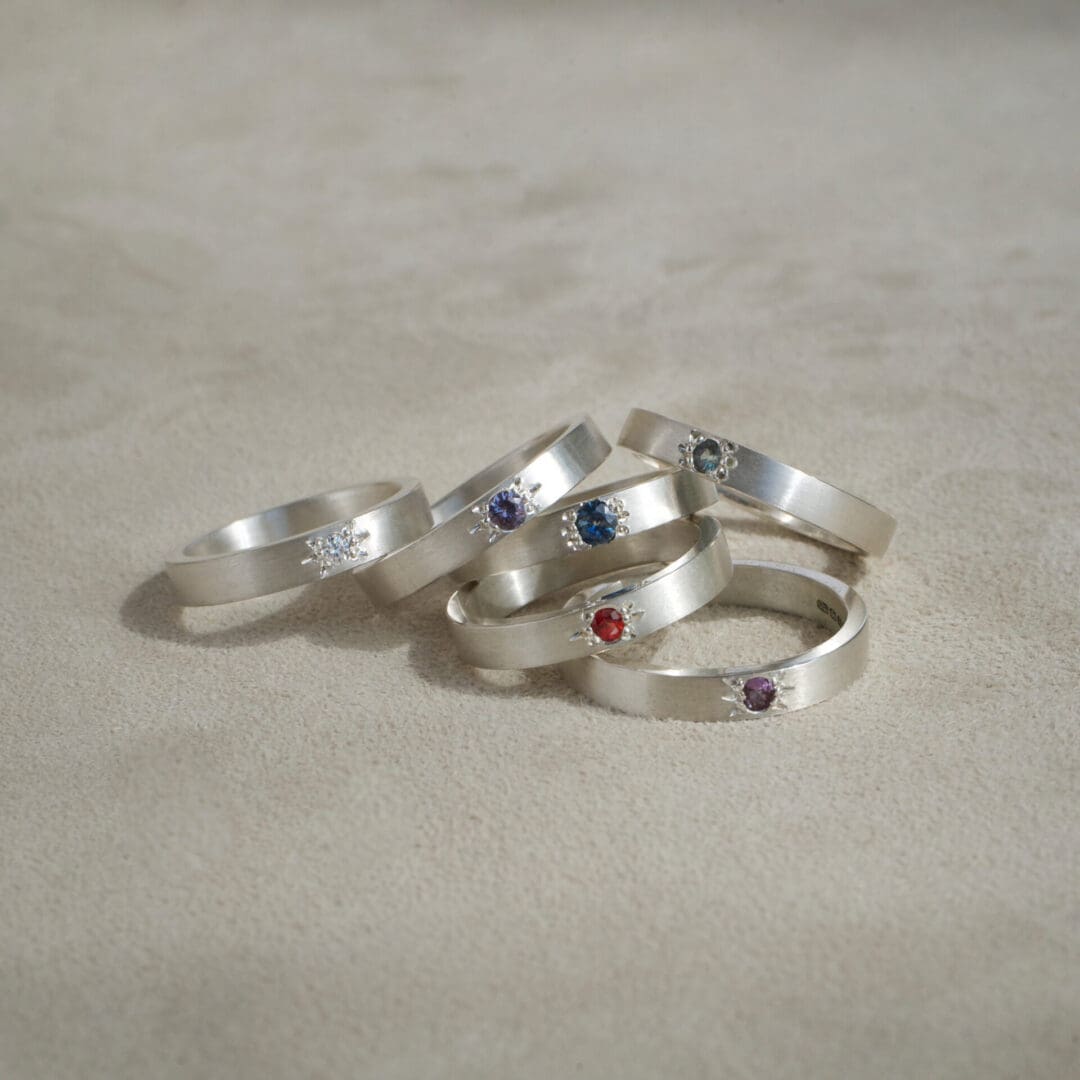 Multiple handmade star set gemstone and argentium silver rings, sapphire and spinel