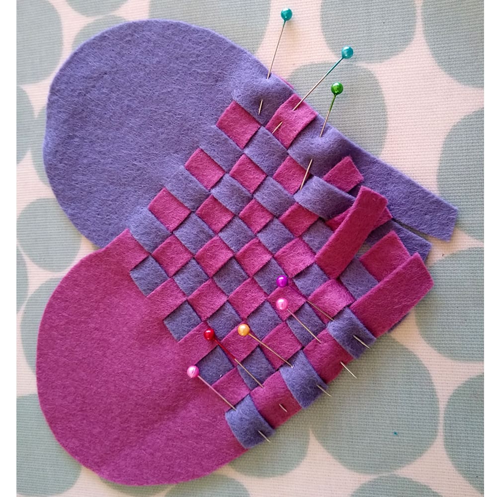 The felt from the lavender woven heart has been marked up and cut out ready for the two halves of the heart to be woven together.