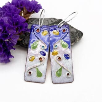 cloisonné enamel long drop oblong earrings of floral and swirl design in pretty colours of blue, pink with green leaves, yellow and red buds. on silver ear wires