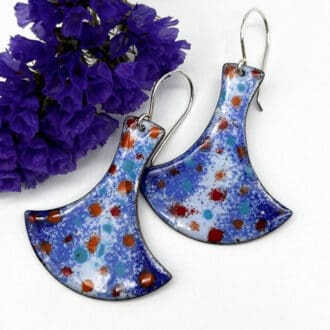 large blue with red spots enamel earrings on silver ear wires. The shape is a little like Thor's hammer