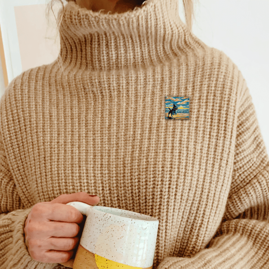 Dog brooch on a cosy sweater.