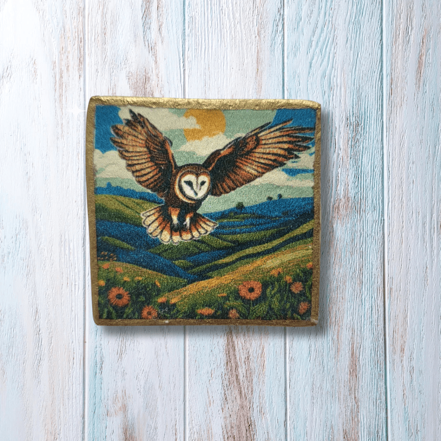 Square clay brooch featuring a colourful flying barn owl print.