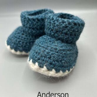 Pair of 100% Scottish Wool Baby soft shoes booties. Presented with a tartan ribbon and box. Handmade in Scotland by Midge Porter Design as part of the 'Peedie Naturals' Clan colours range - Anderson