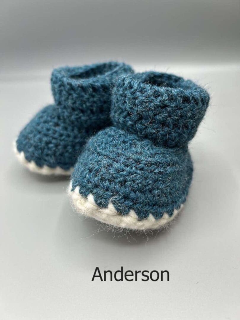 Pair of 100% Scottish Wool Baby soft shoes booties. Presented with a tartan ribbon and box. Handmade in Scotland by Midge Porter Design as part of the 'Peedie Naturals' Clan colours range - Anderson