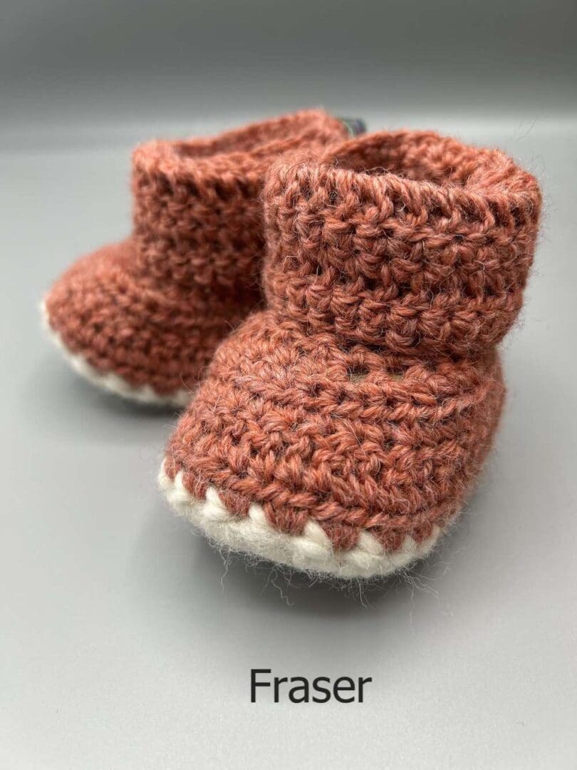 Pair of 100% Scottish Wool Baby soft shoes booties. Presented with a tartan ribbon and box. Handmade in Scotland by Midge Porter Design as part of the 'Peedie Naturals' Clan colours range - Fraser