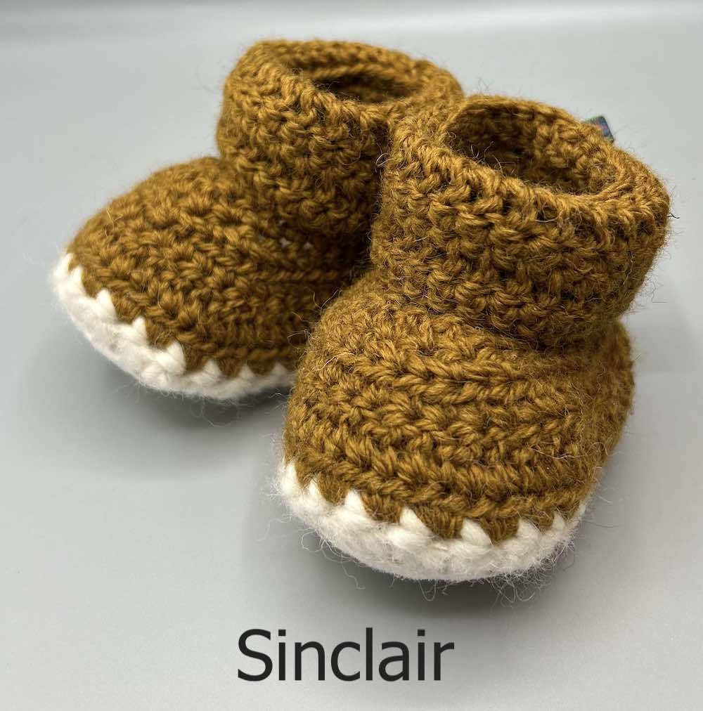 Pair of 100% Scottish Wool Baby soft shoes booties. Presented with a tartan ribbon and box. Handmade in Scotland by Midge Porter Design as part of the 'Peedie Naturals' Clan colours range - Sinclair