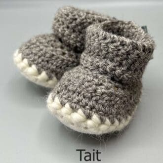 Pair of 100% Scottish Wool Baby soft shoes booties. Presented with a tartan ribbon and box. Handmade in Scotland by Midge Porter Design as part of the 'Peedie Naturals' Clan colours range - Tait