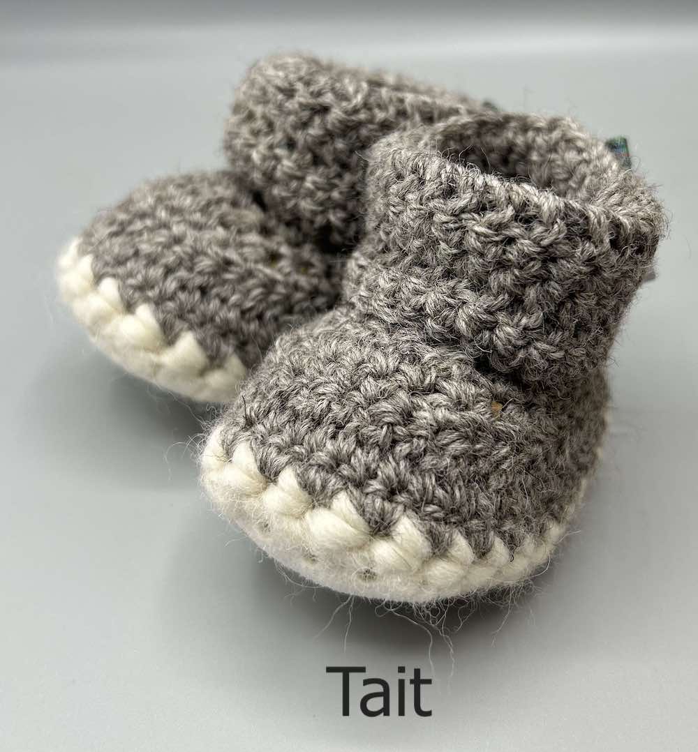 Pair of 100% Scottish Wool Baby soft shoes booties. Presented with a tartan ribbon and box. Handmade in Scotland by Midge Porter Design as part of the 'Peedie Naturals' Clan colours range - Tait